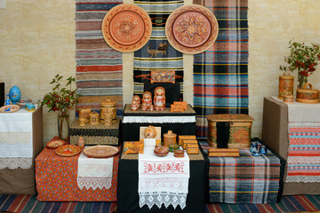 Decorative plates, caskets and box of birch bark with hand-painted, rugs and lace. Handcrafted vintage wooden utensils. Russian traditional handmade souvenirs