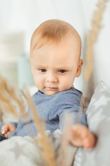 Fototapeta premium Happy Baby. Image of sweet baby boy, closeup portrait of child, cute toddler. Children, people, infancy and age concept