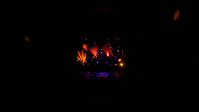 Multi-colored stage lights, light show at the concert. Light and smoke show on the stage.