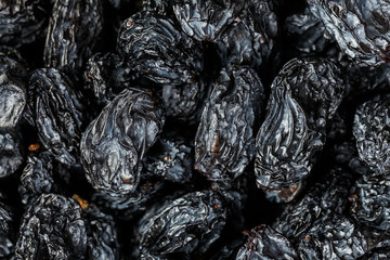 Black Raisin texture, popular dried fruit. Dried grapes.