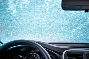 car window under a layer of snow -internal look,Winter frozen car window
