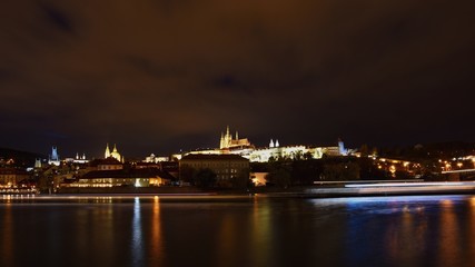Fototapeta na wymiar A panoramic view Prague Castle, the Charles Bridge and the Vltava River in the beautiful city of Prague, Czech Republic - Europe. A beautiful night photo of the architecture of the capital.