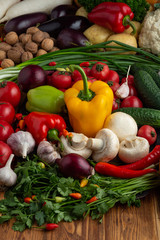 Vegetables and nuts on a brown wooden background