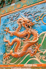 Fototapeta na wymiar The Nine-Dragon Wall (Jiulongbi) at Beihai park, Beijing, China. The wall was built in 1756 CE