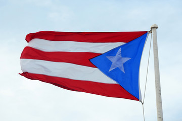 Flag of the Commonwealth of Puerto Rico at Castillo de San Cristobal, San Juan, Puerto Rico. Castillo de San Cristobal is designated as UNESCO World Heritage Site since 1983.