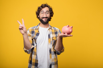 young crazy mad man  fool pose with a piggy bank. savings concep