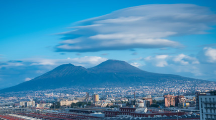 Naples cityscape and volcano Vesuvius with unusual clouds over it. Italy