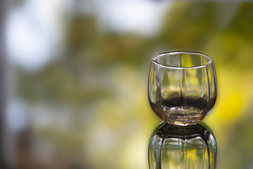 Blank of Glass  with blurred nature background.