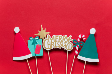 Christmas photo booth props on a red background © ink drop