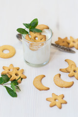sweet homemade yogurt with cookies in a glass cup