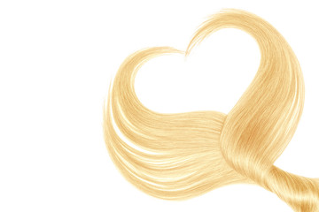 Blond hair in shape of heart, isolated on white background