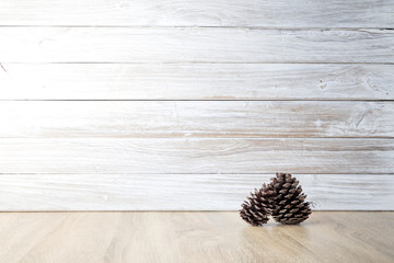 pine cones with wall white wooden