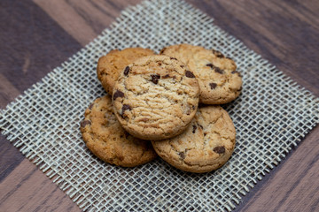 Wholemeal biscuits made emc, on wooden table. Homemade cookie, very tasty.