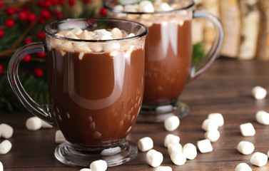 Pair of Mugs Filled with Hot Chocolate and Marshmallows on a Wooden Table