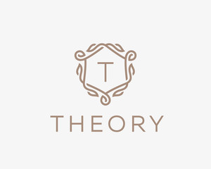 Premium linear shield monogram letter T logotype. Elegant crest leaf stamp icon vector logo. Luxury alphabet frame symbol.