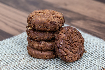 Wholemeal biscuits made emc, on wooden table. Homemade cookie, very tasty.