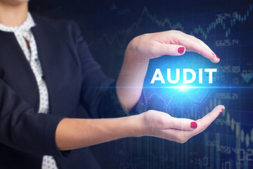 The concept of business, technology, the Internet and the network. A young entrepreneur working on a virtual screen of the future and sees the inscription: Audit