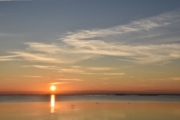 Fototapeta premium Beautiful sunset by a calm water