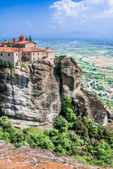 Fototapeta na wymiar The monastery rises above the mountain valley