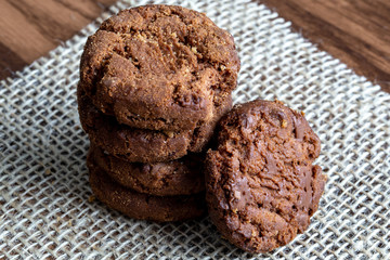 Wholemeal biscuits made emc, on wooden table. Homemade cookie, very tasty.