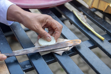making rice biscuits for a sacrifice feast in Bali Ubud for a big sacrificial feast