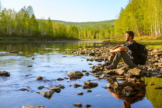 Tourist in Tynda Town and Tynda River in Blagoveshensk Region in Siberia in Far East of Russia