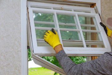Workers preparing to master removes old wooden windows