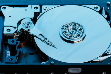 Disassembled hard drive from the computer, hdd with mirror effect. Opened hard drive from the...