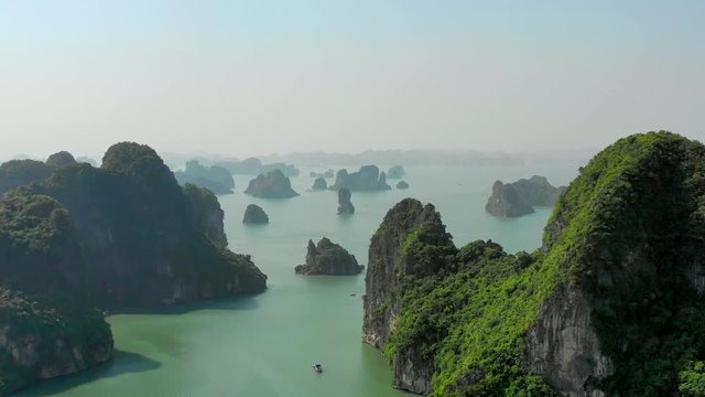 Flying drone between islands of Ha Long Bay, a UNESCO world heritage site. Part 3 of a 3 part series, can be merged into a continuous movie. 