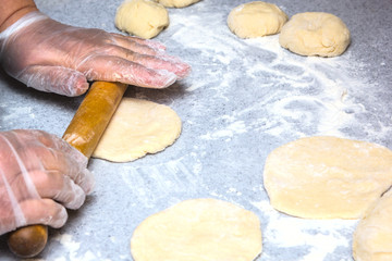 rolling out dough for pies