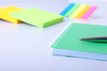 Business concept. Top view of kraft spiral notebook, glasses and pen isolated on background for mockup.