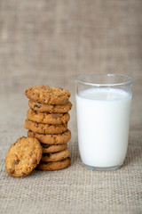  Photograph of a glass of milk with homemade cookies. American type cookie, tasty and very beautiful.