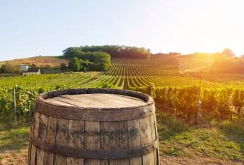 Zelfklevend Fotobehang Red wine with barrel on vineyard in green Tuscany, Italy © kishivan