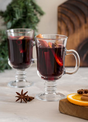Mulled wine in glass at white background