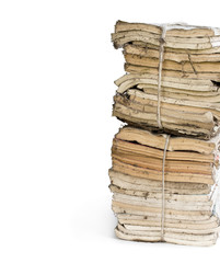 Stack of old and dusty magazines isolated on white