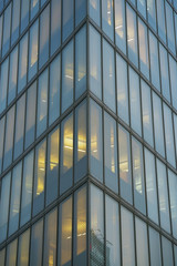 Glass grey square Windows of modern city business building skyscraper. Modern apartment buildings in new neighborhood. Windows of a building, texture.