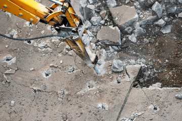 Heavy construction equipment works on the construction and repair of roads.