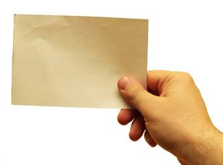 Hand holding a blank piece of paper