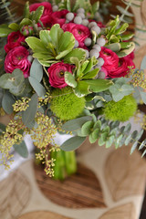 bridal bouquet of fresh roses on the table. wedding floristry, floristic decorative statement