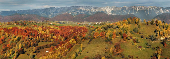 Amazing panorama of colorful hills and mountains in Transylvania during autumn