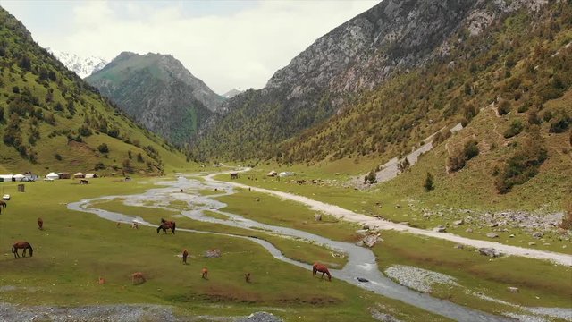 Murdash Village Alay Valley Kyrgyzstan Osh Region. A View of Alay Valley, Trans-alay Range, and Kyzyl-suu (West) River.  Alay Mountains. Murdash Village Is 100 Km From Osh City. Areal Dron Shoot.