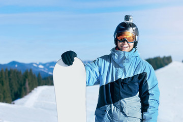 snowboarder and snowboard, portrait on a background of mountains