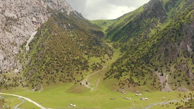 Murdash Village Alay Valley Kyrgyzstan Osh Region. A View of Alay Valley, Trans-alay Range, and Kyzyl-suu (West) River.  Alay Mountains. Murdash Village Is 100 Km From Osh City. Areal Dron Shoot.