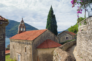 Fototapeta premium Montenegro. View of ancient town of Perast and temple of the Nativity of the Virgin Mary