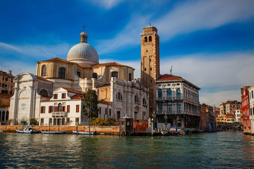 Fototapeta premium Venice canal with boats and old architecture