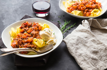 Pappardelle pasta with meat ragout and burrata cheese
