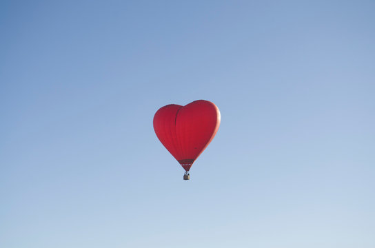 Red balloon in the shape of a heart