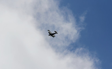 Fototapeta na wymiar Airplane entering clouds