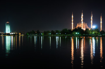 Fototapeta premium The view mosque and reflection at night, city background.