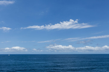 Fototapeta na wymiar perfect sky, sailing boat and water of ocean